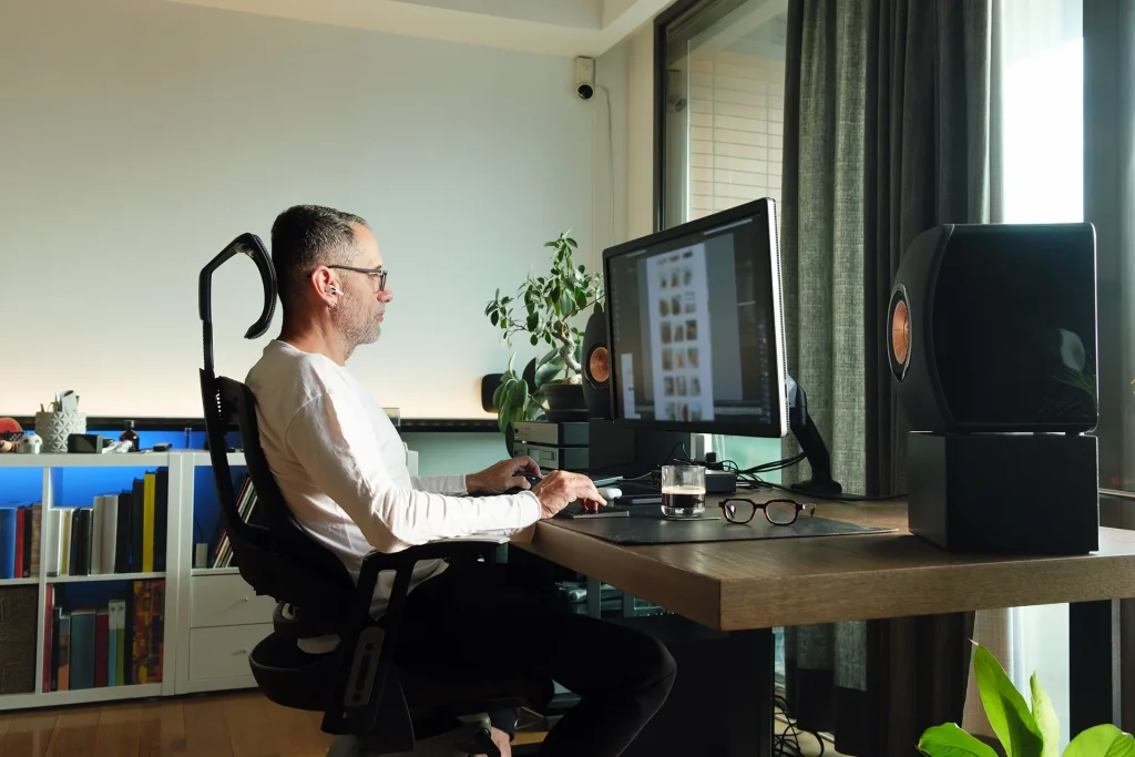 Middle age man working on computer at home.
