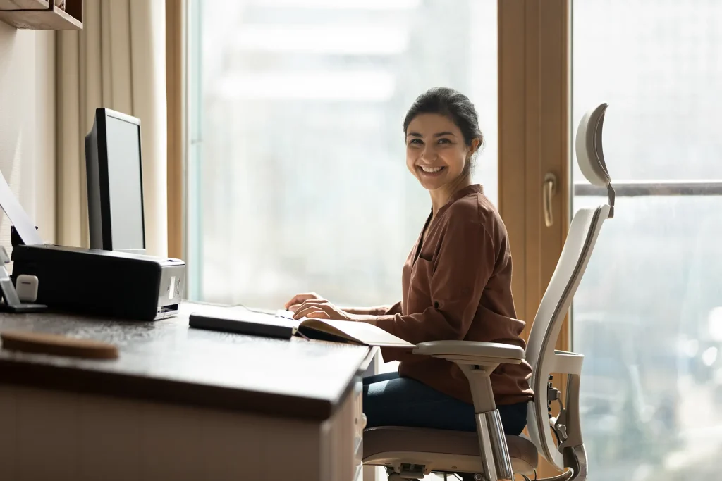 business woman freelancer sit by computer at comfy workplace