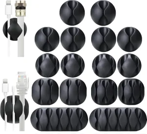 An assortment of multi-slot black silicone clips for desktop cable management.
