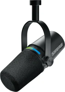 Shure MV7X podcast microphone with foam windscreen on a black mount.