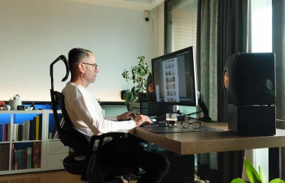 Middle age man working on computer at home.