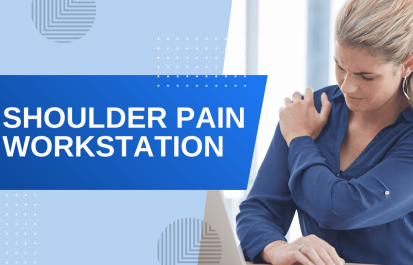 Upset blonde woman in blue shirt holding her shoulder in pain while working at a laptop in an office.